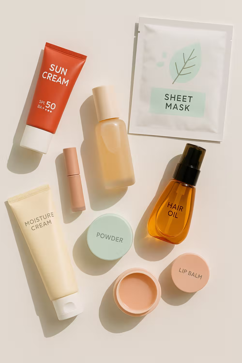 K-Beauty_1_v Affordable Korean skincare flatlay including sunscreen, sheet masks, lip tint and hair serum