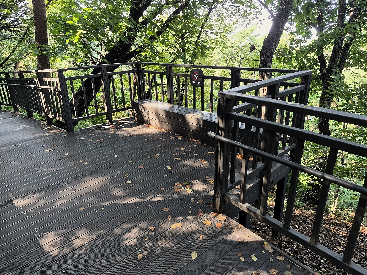 Seoul Trail Course 4: Mangu-Yongmasan 3 Corner of a wooden deck with a built-in bench