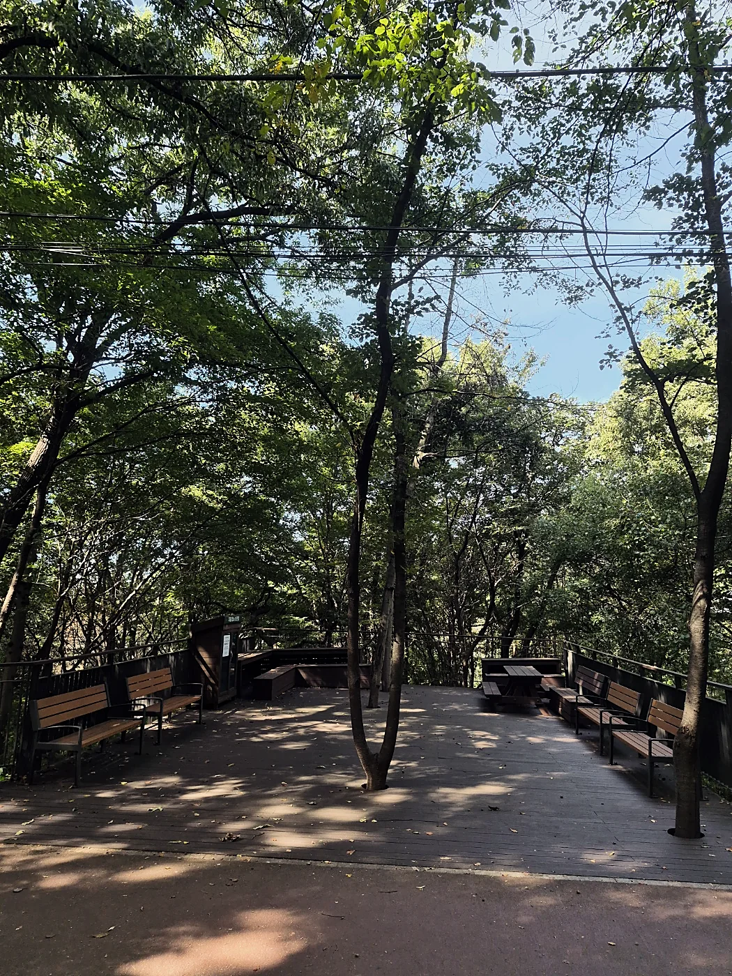 Seoul Trail Course 4: Mangu-Yongmasan 23 Wooden deck rest area with benches and tables